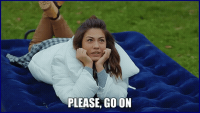 A Woman Laying On A Blue Mattress With The Words Please Go On Written Below Her GIF