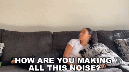 A Woman Laying On A Couch With The Words " How Are You Making All This Noise " GIF