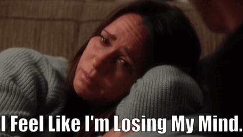 A Woman Laying On A Couch With The Words " I Feel Like I 'M Losing My Mind " GIF