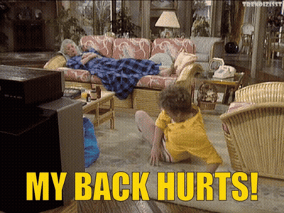 A Woman Laying On A Couch With The Words " My Back Hurts " Below Her GIF