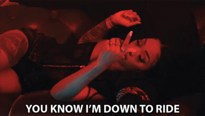A Woman Laying On A Man 'S Lap With The Words " You Know I 'M Down To Ride " Below Her GIF