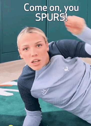 A Woman Laying On A Mat With The Words Come On You Spurs GIF