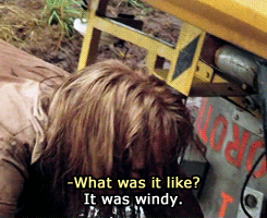 A Woman Laying On The Ground With The Words What Was It Like It Was Windy On The Bottom GIF