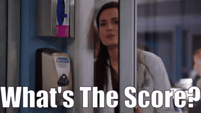 A Woman Leaning Against A Wall With The Words What 'S The Score Written On The Bottom GIF