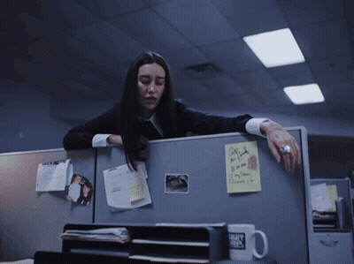 A Woman Leans Over A Cubicle With A Sticky Note On It That Says Call Me If You Need A Day Off GIF