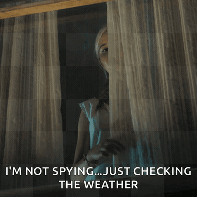 A Woman Looking Out Of A Window With The Words " I 'M Not Spying Just Checking The Weather " Below Her GIF