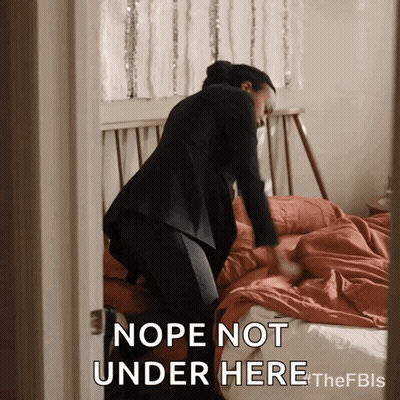 A Woman Making A Bed With The Words Nope Not Under Here Below Her GIF