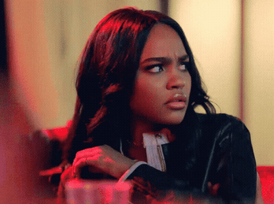 A Woman Making A Funny Face With Her Arms Crossed GIF