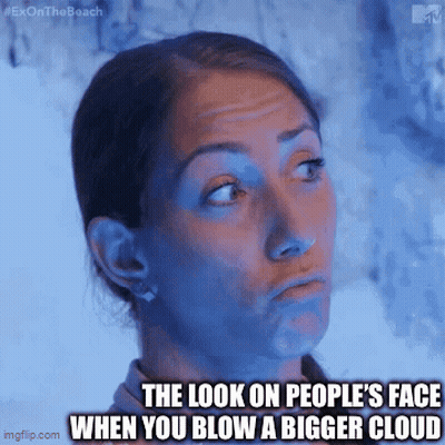 A Woman Making A Funny Face With The Caption " The Look On People 'S Face When You Blow A Bigger Cloud " . GIF