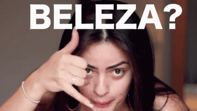 A Woman Making A Funny Face With The Words Beleza Written Above Her GIF
