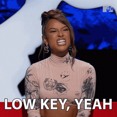 A Woman Making A Funny Face With The Words Low Key Yeah Behind Her GIF