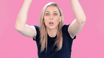 A Woman Making A Surprised Face In Front Of The Word Ghoul GIF