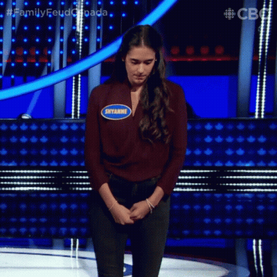 A Woman On A Stage With A Name Tag That Says Siyamge GIF