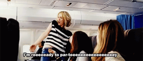 A Woman On An Airplane Says I 'M Reeeeeady To Par-Teeee GIF