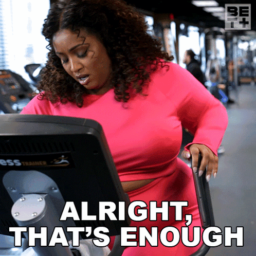 A Woman On An Exercise Bike With The Words Alright That 'S Enough Behind Her GIF