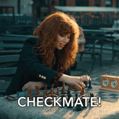 A Woman Playing A Game Of Chess With The Words Checkmate On The Bottom Right GIF