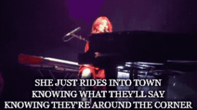 A Woman Playing A Piano With The Words She Just Rides Into Town Above Her GIF
