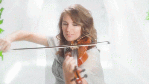 A Woman Playing A Violin With A White Background GIF