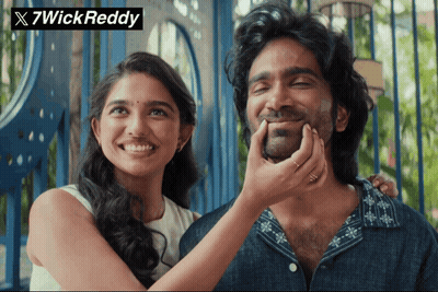A Woman Putting Her Hand On A Man 'S Face With 7Wick Reddy Written On The Bottom GIF