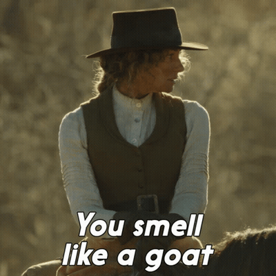 A Woman Riding A Horse With The Words You Smell Like A Goat GIF