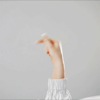 A Woman 'S Arm Is Shown With A White Sleeve And A White Background GIF