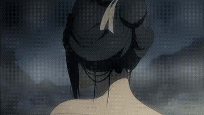 A Woman 'S Back Is Shown With A Bun And A Feather In Her Hair GIF