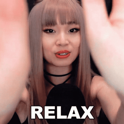 A Woman 'S Face Is Behind A Microphone With The Word Relax Written On It GIF
