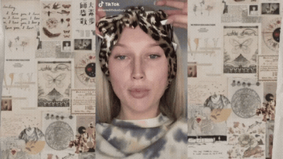 A Woman 'S Face Is Shown In Front Of A Collage Of Papers Including One That Says I Love You I Love GIF