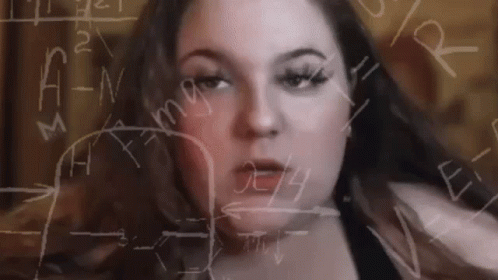 A Woman 'S Face Is Surrounded By Mathematical Equations On A Whiteboard . GIF