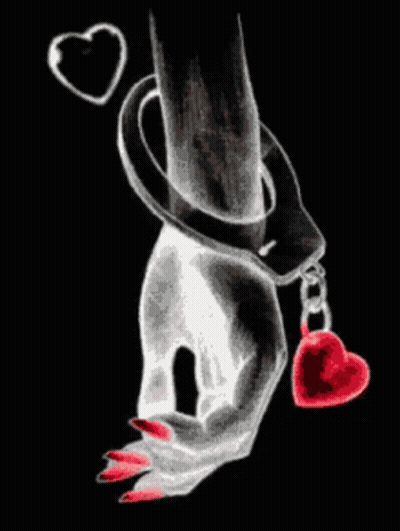 A Woman 'S Hand In Handcuffs Holding A Heart GIF