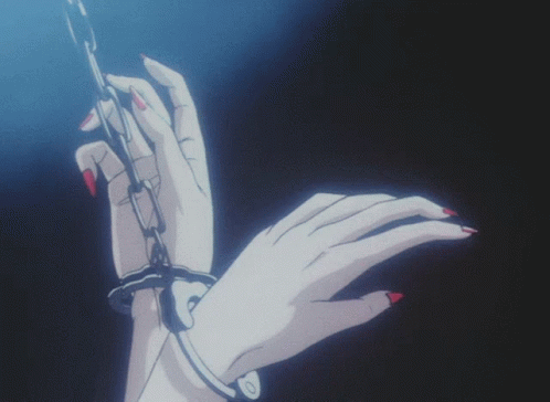 A Woman 'S Hand Is Chained To A Chain GIF