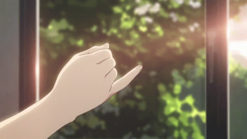 A Woman 'S Hand Is Reaching Out Towards A Window With Trees In The Background . GIF