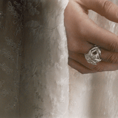A Woman 'S Hand With A Ring On Her Finger GIF