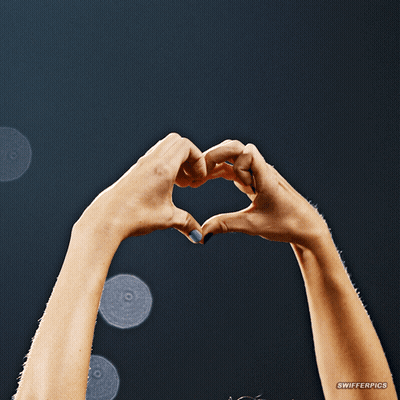 A Woman 'S Hands Are Making A Heart Shape With A Watermark That Says Swiferpics GIF