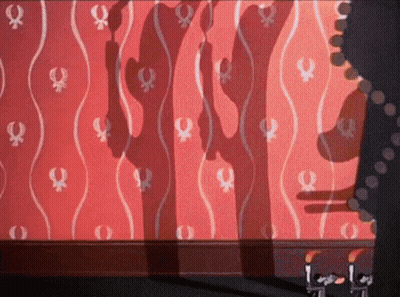 A Woman 'S Shadow Is Projected On A Wall With A Pattern Of Female Symbols GIF