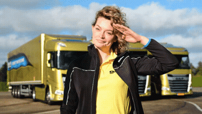 A Woman Salutes In Front Of A Truck That Says ' Daf ' On It GIF
