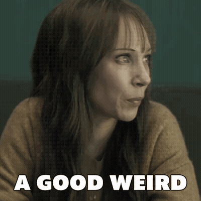 a woman says a good weird while looking at something