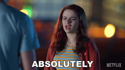 A Woman Says Absolutely In Front Of A Man In A Striped Shirt GIF
