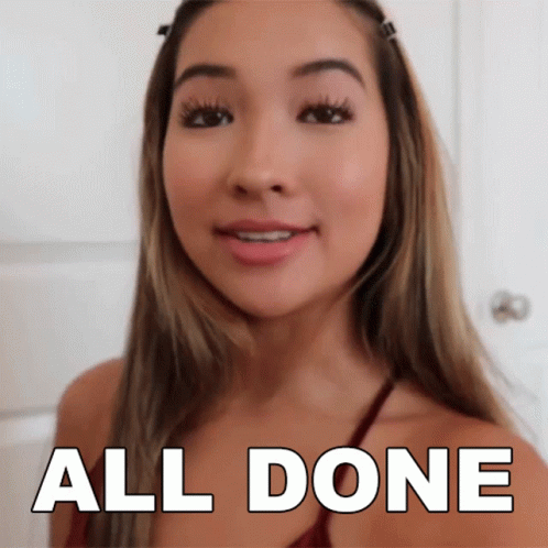 A Woman Says All Done In Front Of A White Background GIF