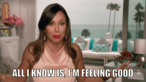 A Woman Says " All I Know Is I 'M Feeling Good " In A Living Room GIF
