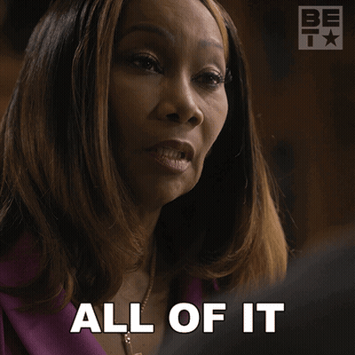 A Woman Says " All Of It " In Front Of A Be Icon GIF