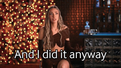 A Woman Says " And I Did It Anyway " While Sitting In Front Of A Christmas Tree GIF