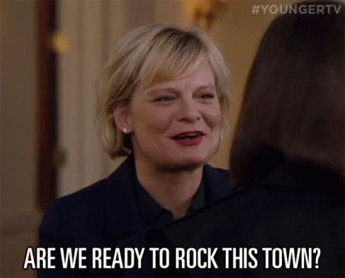 A Woman Says " Are We Ready To Rock This Town " To Another Woman GIF