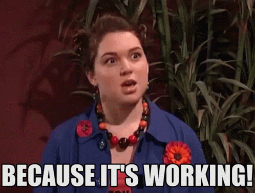 A Woman Says " Because It 'S Working " While Standing In Front Of A Plant GIF