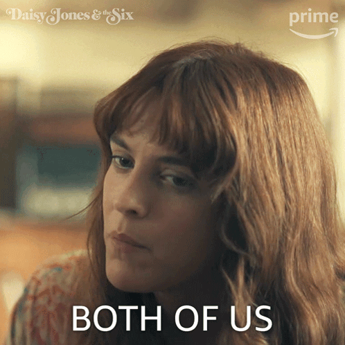 A Woman Says Both Of Us In Front Of A Daisy Jones & The Six Logo GIF