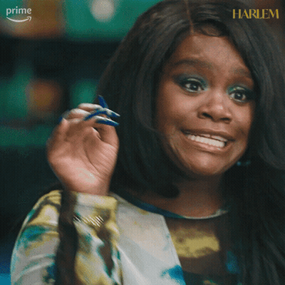 A Woman Says Checkmate With Her Hand Up GIF