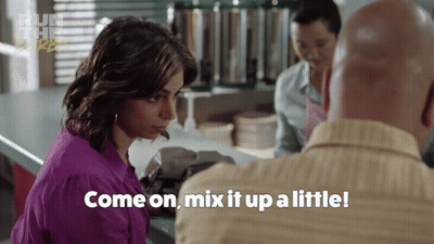 A Woman Says Come On Mix It Up A Little In A Restaurant GIF