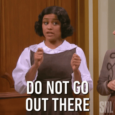 A Woman Says " Do Not Go Out There " While Standing In Front Of A Door GIF