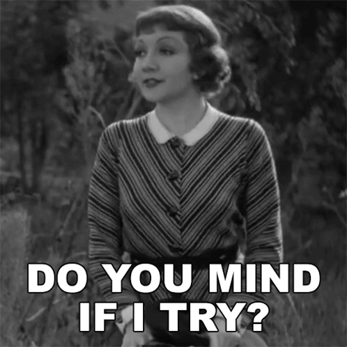 A Woman Says Do You Mind If I Try In A Black And White Photo GIF