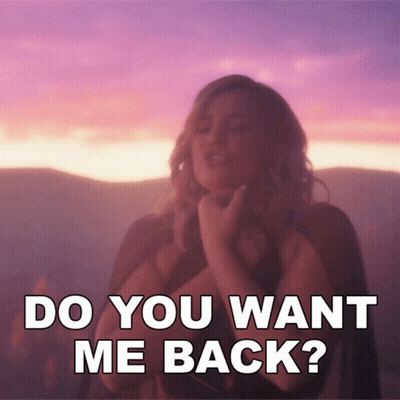 A Woman Says " Do You Want Me Back " While Standing In Front Of A Sunset GIF
